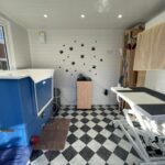 Garden room used as a dog groomers
